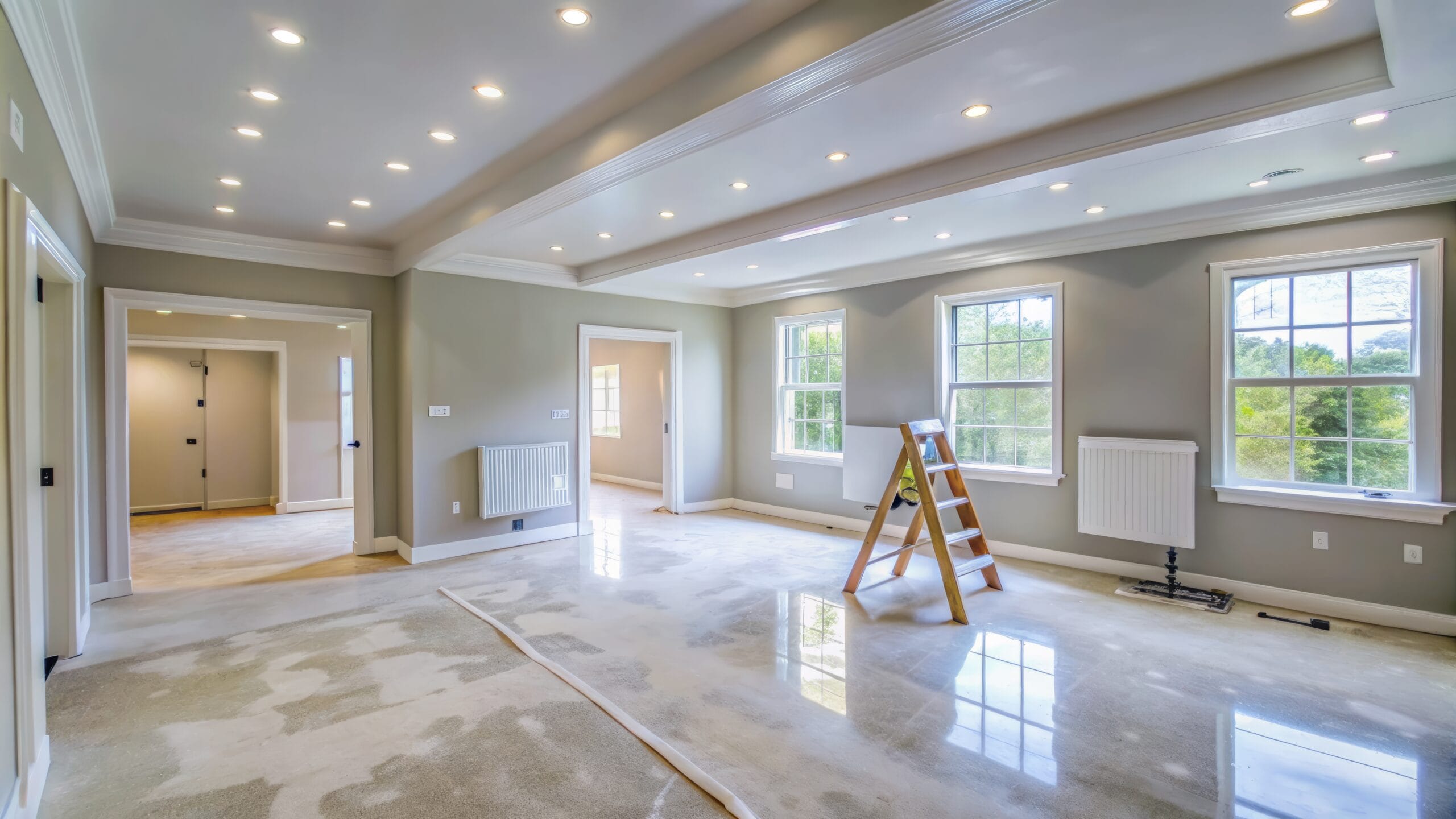 freshly-painted-walls-with-smooth-finish-and-patched-drywall-adorn-the-interior-of-a-home-under-construction-showcasing-a-clean-and-renovated-space-awaiting-final-touches-stockpack-adobe-stock Freshly painted walls with smooth finish and patched drywall adorn the interior of a home under construction, showcasing a clean and renovated space awaiting final touches.